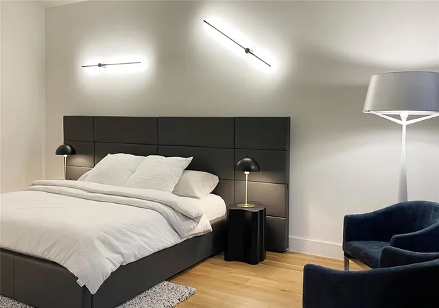 a large white bed in a white room