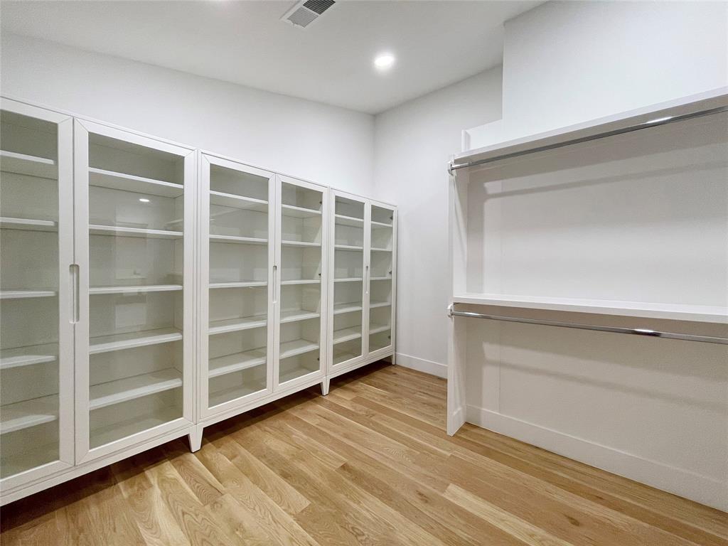 6802 Bert Lane Dallas, TX 75240 - Photo 34 of 38 a view of an empty room with wooden floor and a window