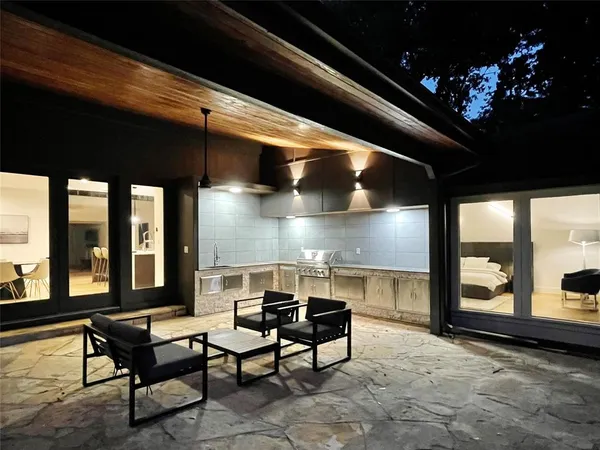 a view of a swimming pool with a patio