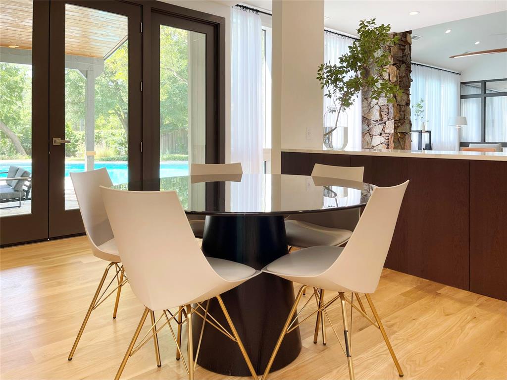 6802 Bert Lane Dallas, TX 75240 - Photo 5 of 38 a view of a dining room with furniture and wooden floor