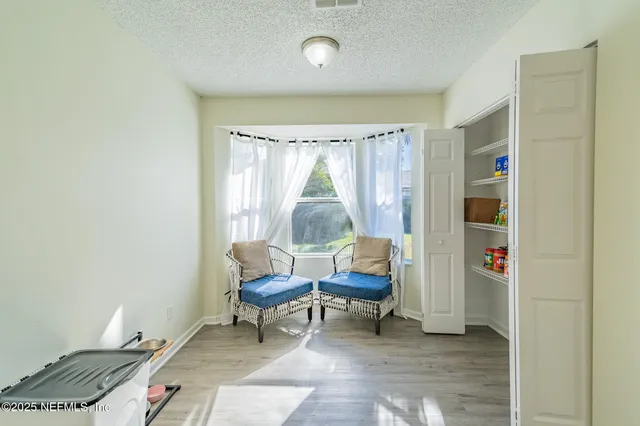 a living room with furniture and a window