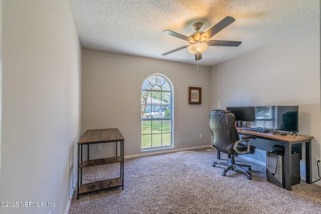 a workspace with furniture and a window