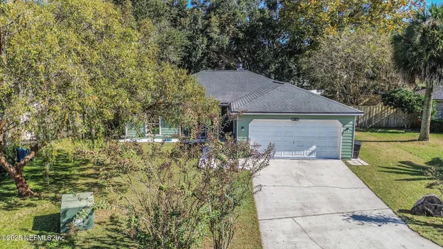 a backyard of a house with table and chairs