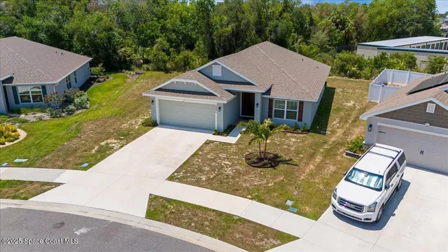 an aerial view of residential building with parking space