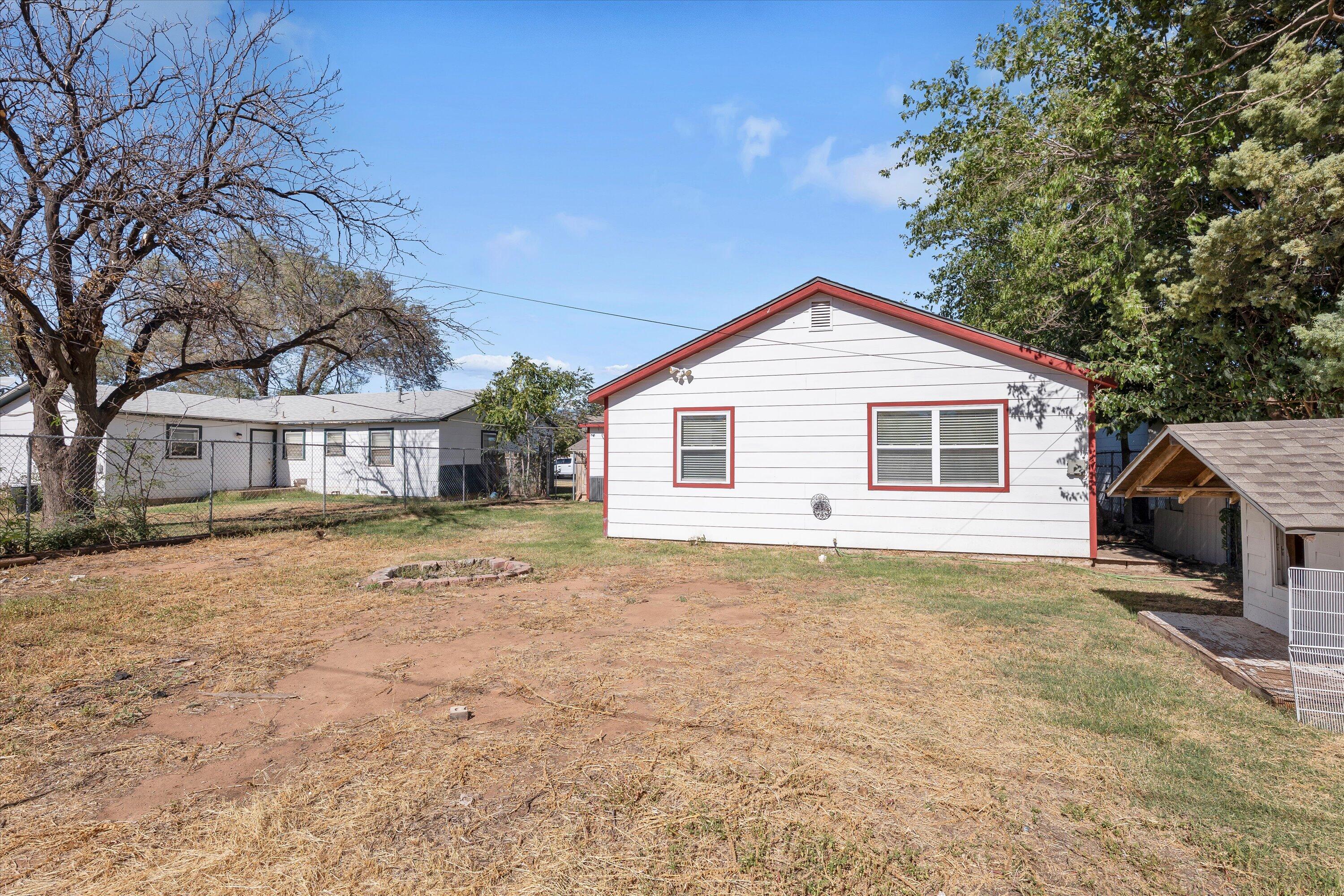 2009 65th Street Lubbock, TX 79412 - Photo 23 of 24 a front view of a house with a yard