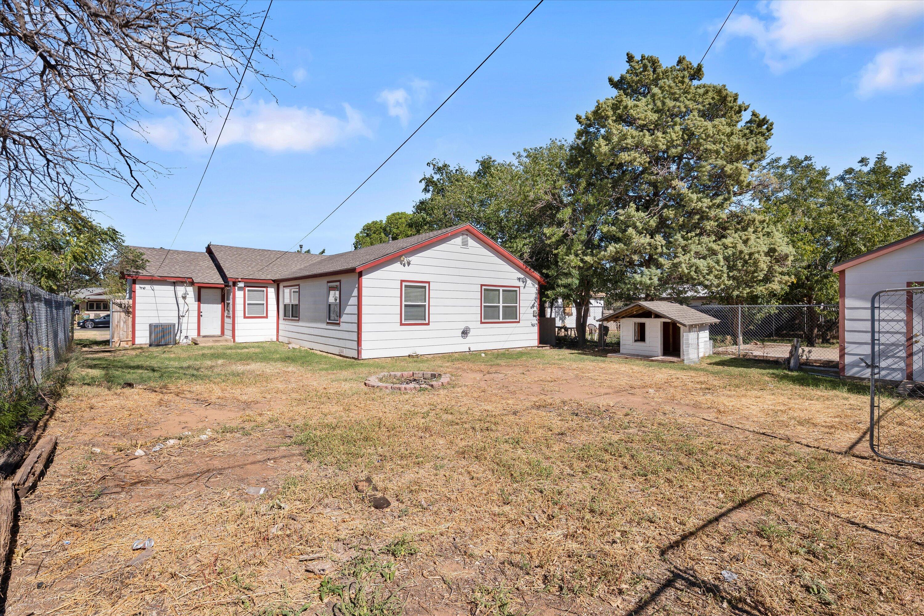 2009 65th Street Lubbock, TX 79412 - Photo 24 of 24 a view of a house with a yard