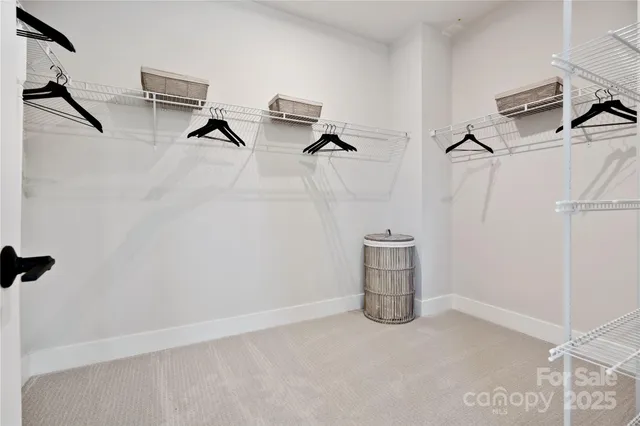 a room with water heater and white walls