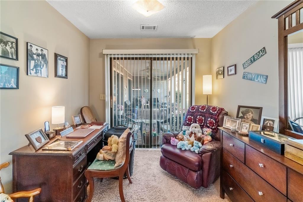 3492 Rosebud Road Loganville, GA 30052 - Photo 13 of 22 a living room with furniture and a window