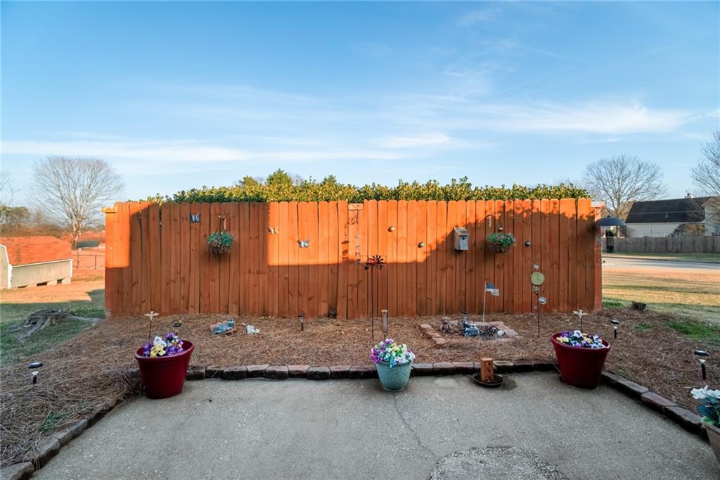 3492 Rosebud Road Loganville, GA 30052 - Photo 19 of 22 a view of swimming pool with couch and chairs