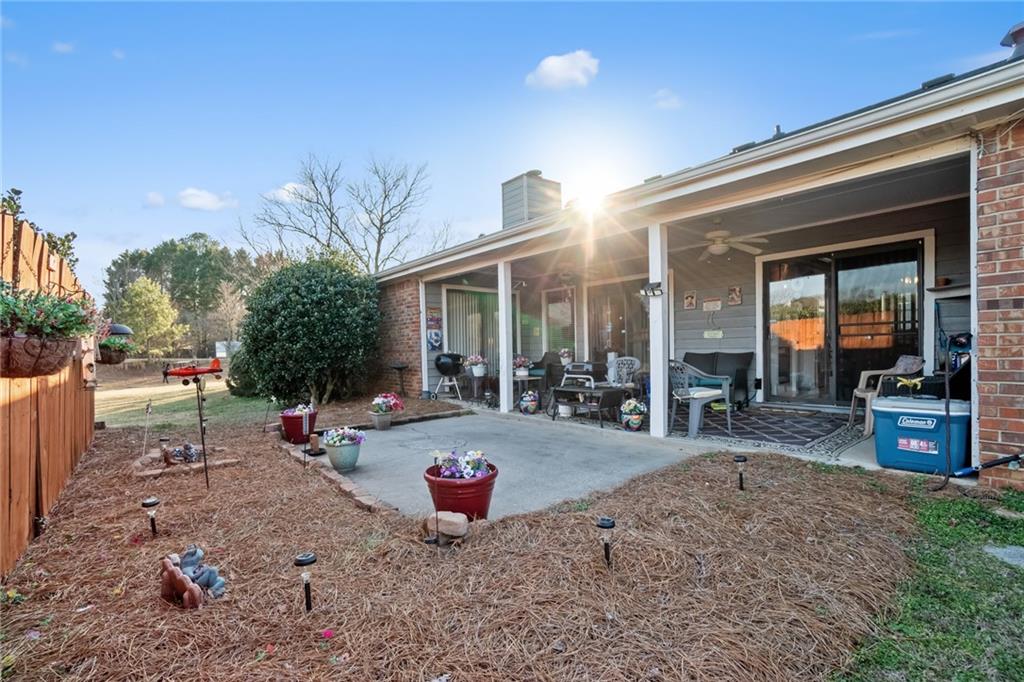 3492 Rosebud Road Loganville, GA 30052 - Photo 20 of 22 a view of a backyard with sitting area
