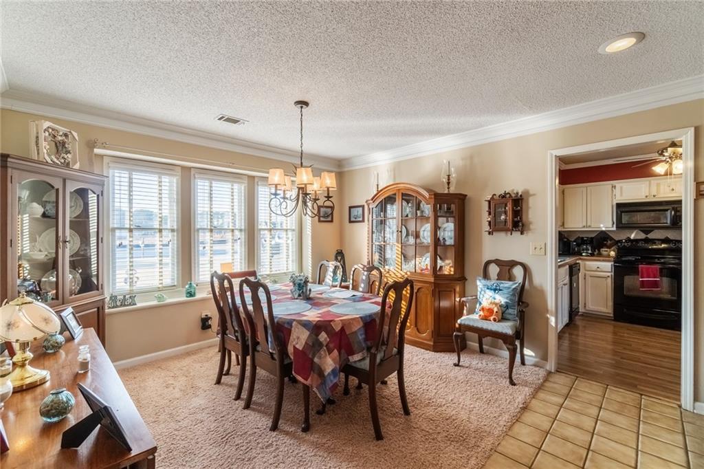 3492 Rosebud Road Loganville, GA 30052 - Photo 8 of 22 a view of a dining room with furniture window and outside view