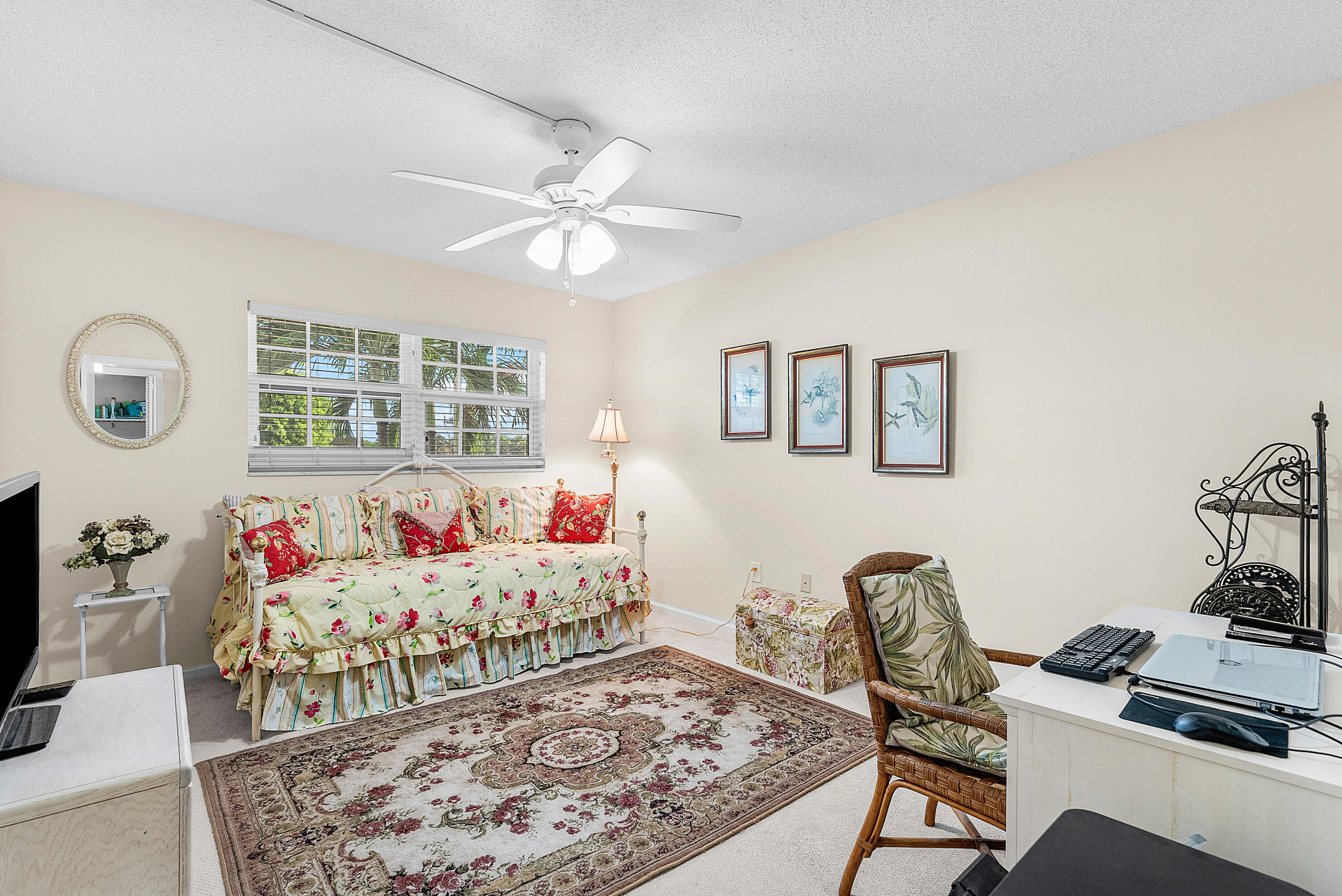 145 Atlantis Boulevard, Unit 203 Atlantis, FL 33462 - Photo 17 of 33 a bedroom with furniture and a bed