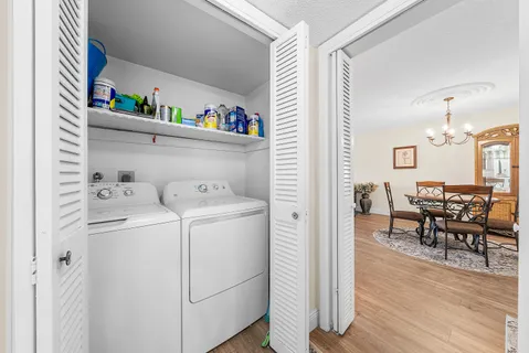a view of a dining room with furniture and wooden floor