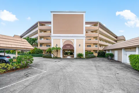 a view of a house with plants and entryway