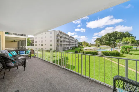 a view of a chair and table in the balcony