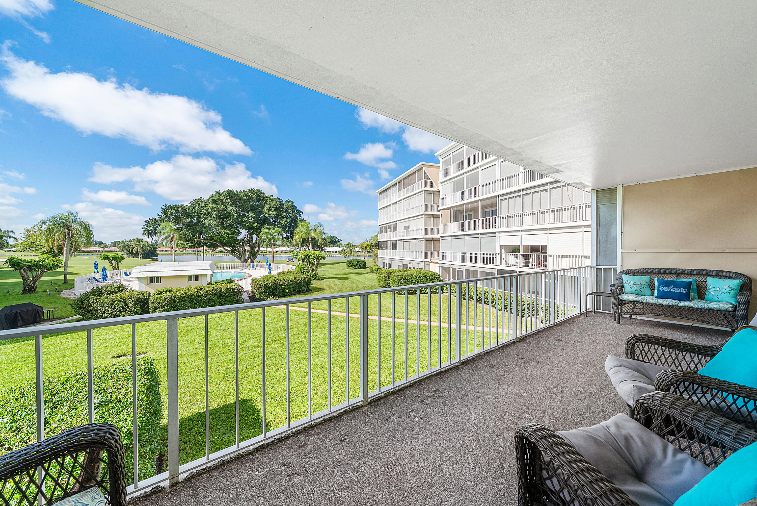 145 Atlantis Boulevard, Unit 203 Atlantis, FL 33462 - Photo 23 of 33 a view of balcony with furniture
