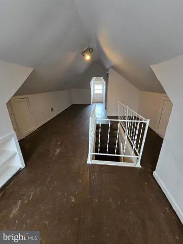 a view of wooden floor with staircase