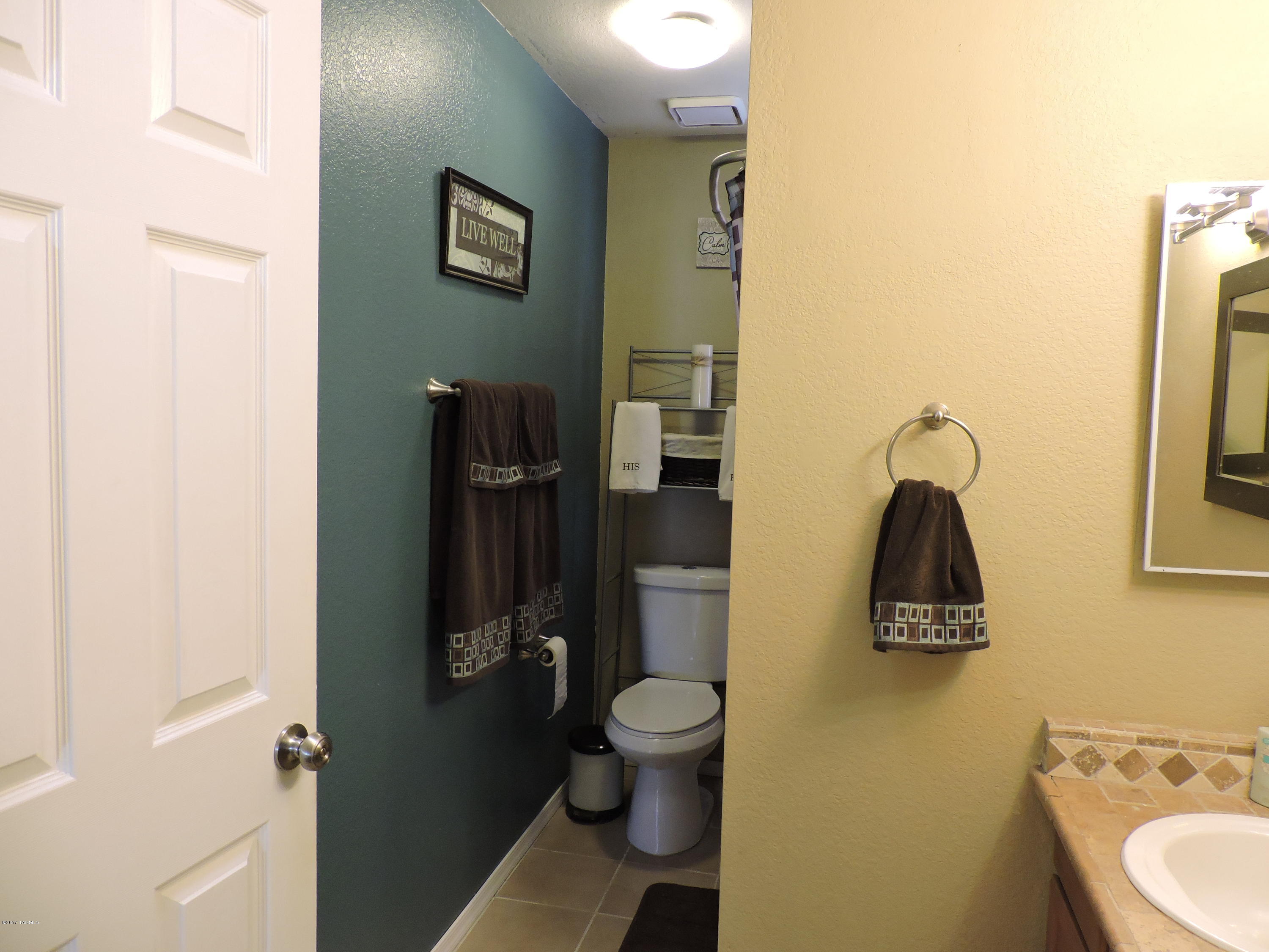 2709 West Firebrook Road Tucson, AZ 85741 - Photo 9 of 17 a bathroom with a toilet sink and shower