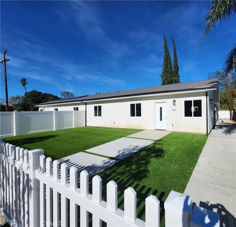 19453 Strathern Street Reseda, CA 91335 - Photo 3 of 12 a front view of a house with garden