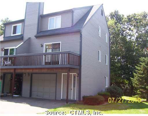 62 Woodland Ridge, Unit 62 Meriden, CT 06450 - Photo 1 of 1 a front view of a house with garden