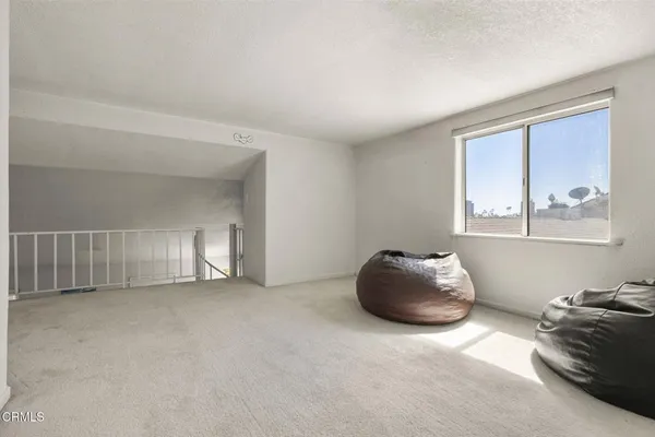 a room with a window and cabinet