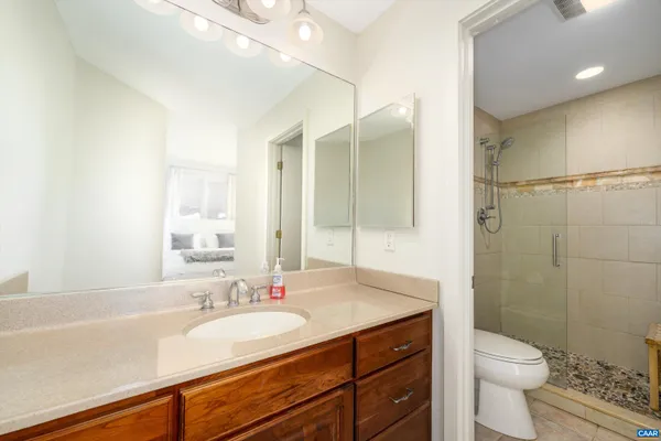 a bathroom with a toilet and shower