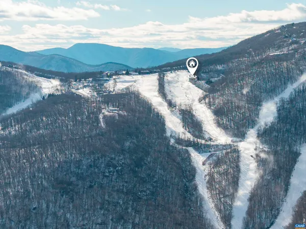 a view of a street with a large building in the background