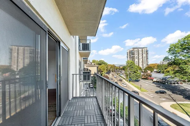 a view of a balcony with city view