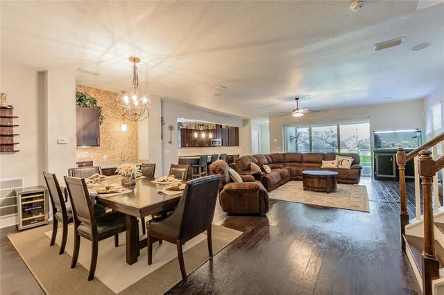 a living room with furniture and a large mirror