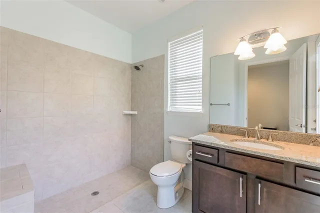 a view of a backyard with a swimming pool