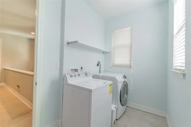 a front view of a house with a yard and porch