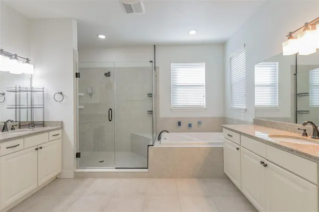 a living room with furniture and a large mirror