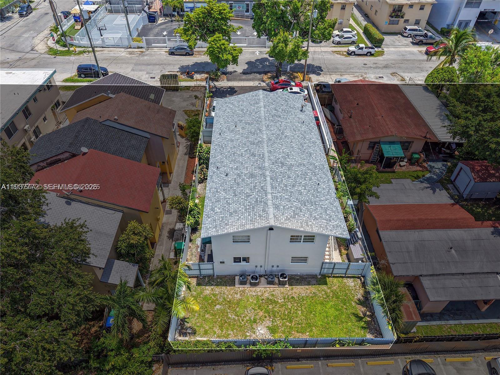 1621 Northwest 16th Street Miami, FL 33125 - Photo 12 of 13 an aerial view of house with yard swimming pool and outdoor seating