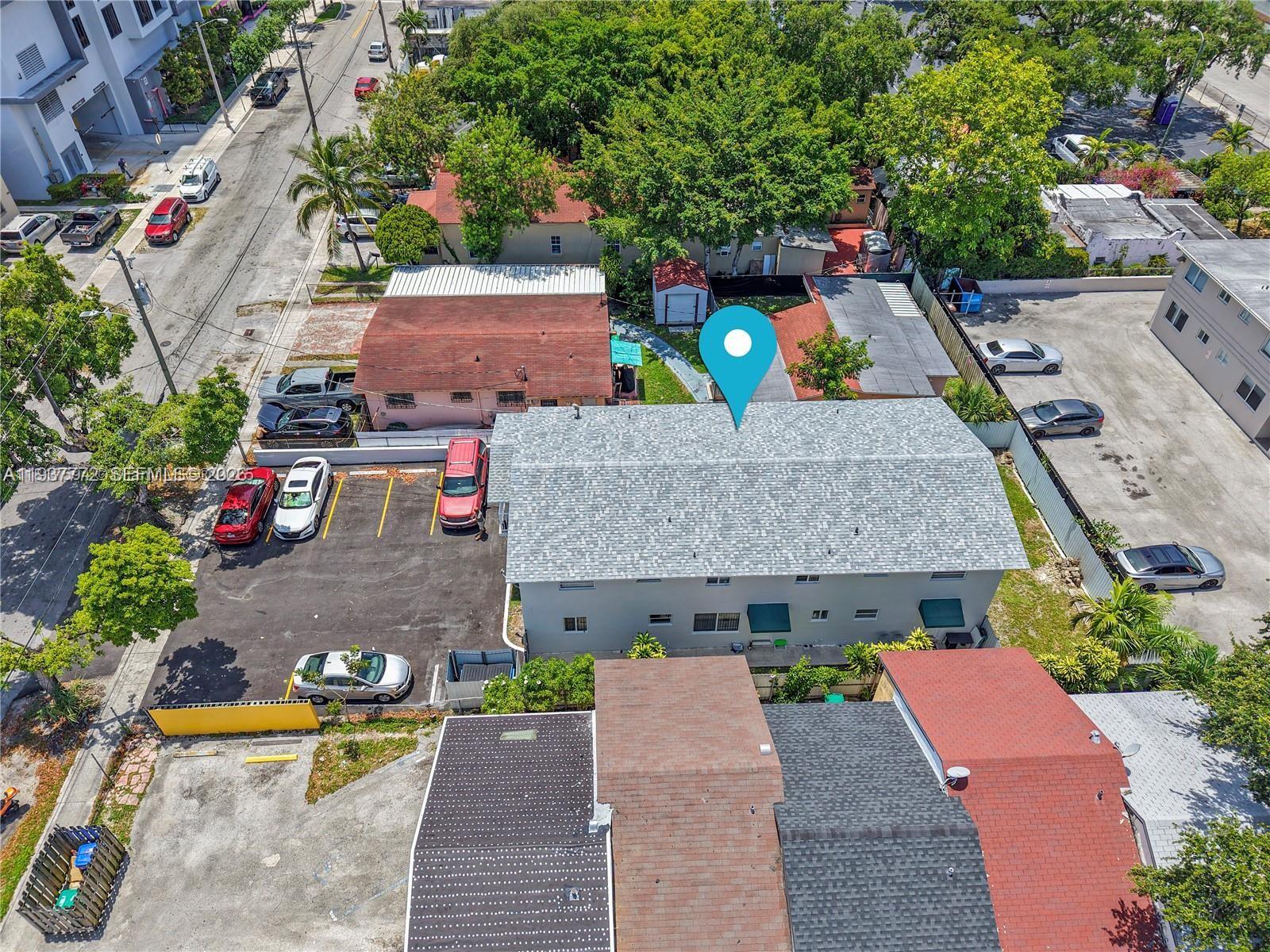 1621 Northwest 16th Street Miami, FL 33125 - Photo 4 of 13 an aerial view of a house with a swimming pool