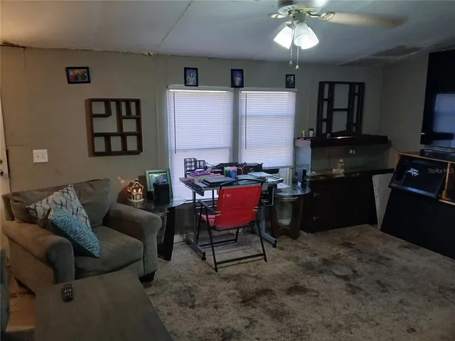 a workspace with furniture and a window