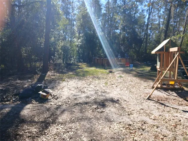 a view of a yard with a tree