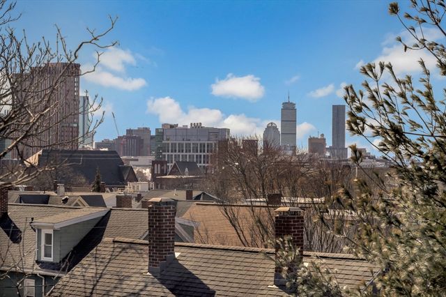 a view of a city with tall buildings
