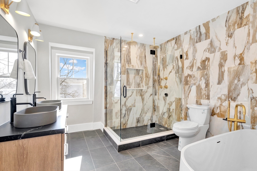 6 Berkeley Street Somerville, MA 02143 - Photo 28 of 41 a living room with furniture and a large window