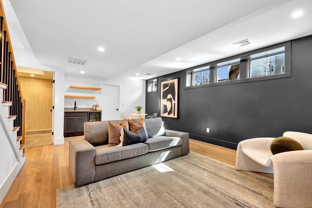 6 Berkeley Street Somerville, MA 02143 - Photo 33 of 41 a living room with furniture and a couch