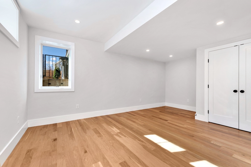 6 Berkeley Street Somerville, MA 02143 - Photo 36 of 41 a view of empty room with wooden floor