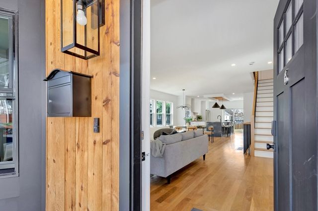 a view of living room with furniture and a window