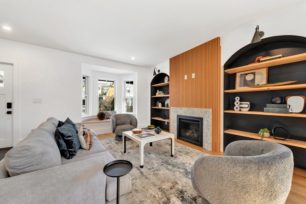 6 Berkeley Street Somerville, MA 02143 - Photo 6 of 41 a living room with furniture and a fireplace