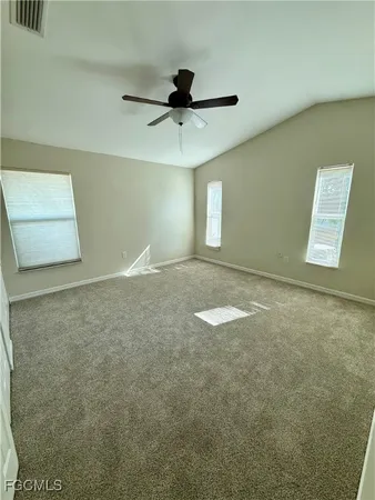 a view of room with window and ceiling fan
