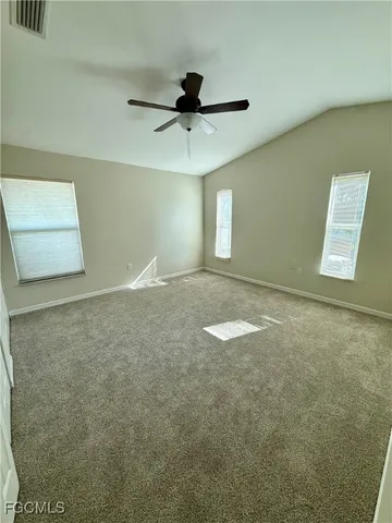 a view of room with window and ceiling fan