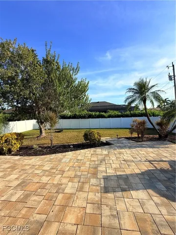 a view of a swimming pool with an outdoor space and seating area