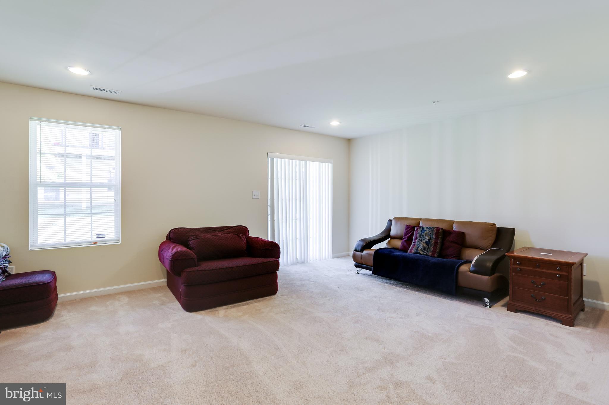 8011 Ravenclaw Road Elkridge, MD 21075 - Photo 21 of 34 Lower Level Family Room w/ Sliding Door