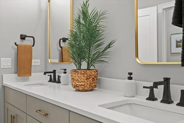 a bathroom with sink and mirror