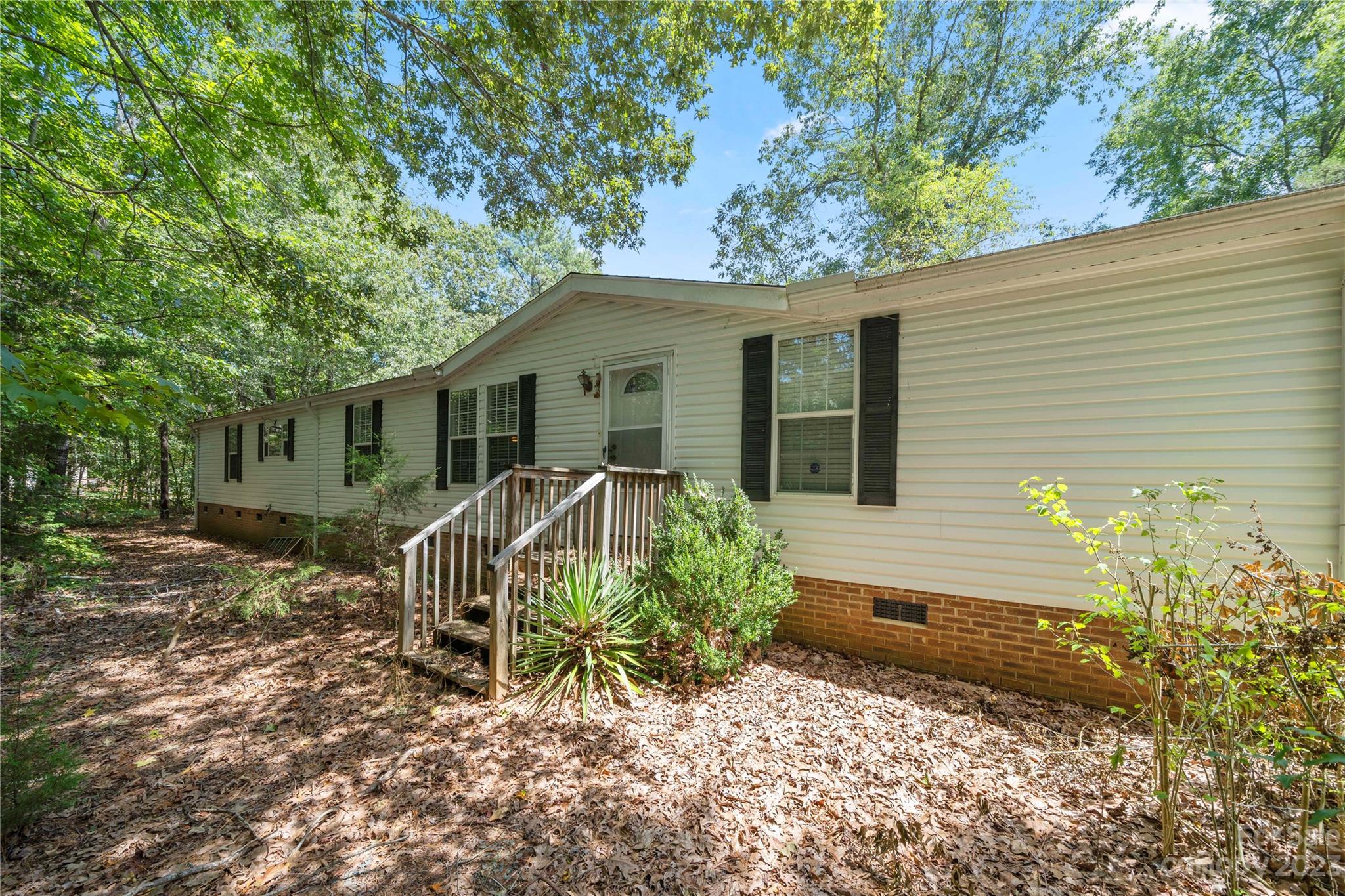 442 Tirzah Church Road Lancaster, SC 29720 - Photo 1 of 29 a house with trees in the background