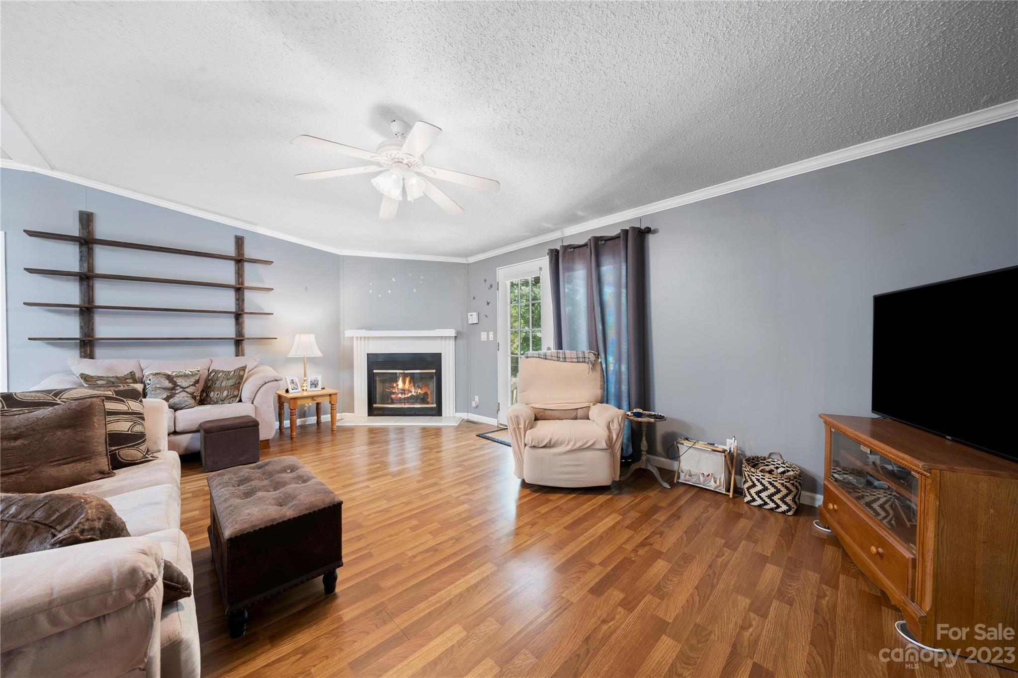 442 Tirzah Church Road Lancaster, SC 29720 - Photo 11 of 29 a living room with furniture and a flat screen tv