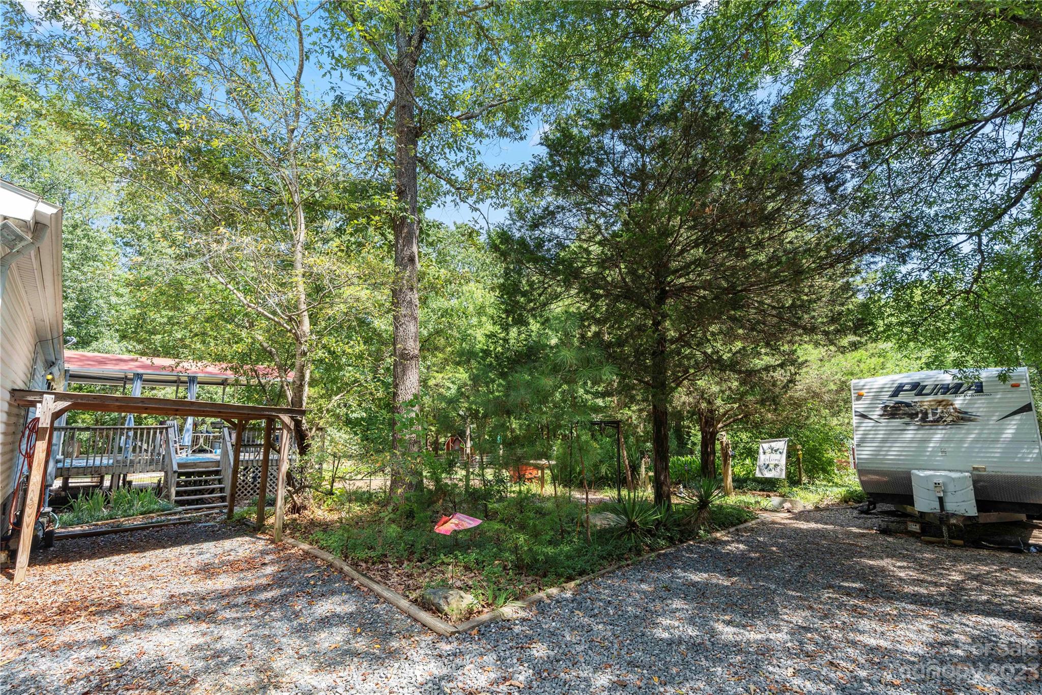 442 Tirzah Church Road Lancaster, SC 29720 - Photo 20 of 29 a view of a house with a tree and a yard